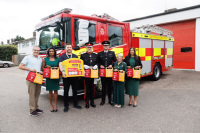 Founders of Hearts for Herts Charity pose with newly donated Mindray BeneHeart C1A AED units outside Hertfordshire fire station