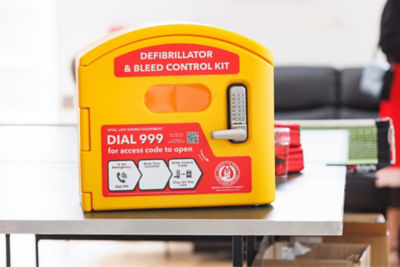 Donated defibrillator and bleed control kit displays on event