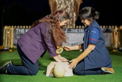 Trainer teaches residents CPR training