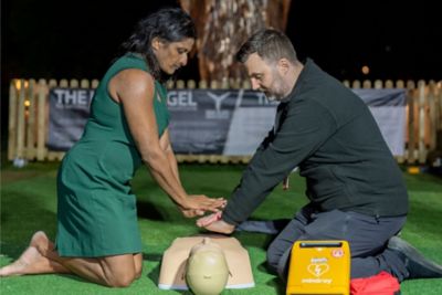 Trainer teaches residents CPR training